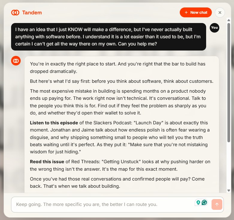 The Tandem agent answering a visitor who has an idea but has never built software, routing them to a podcast episode and a newsletter issue before talking about building.